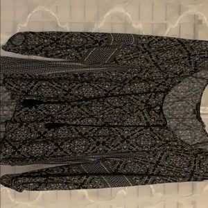 Printed long sleeve blouse. Tassels at neck line.